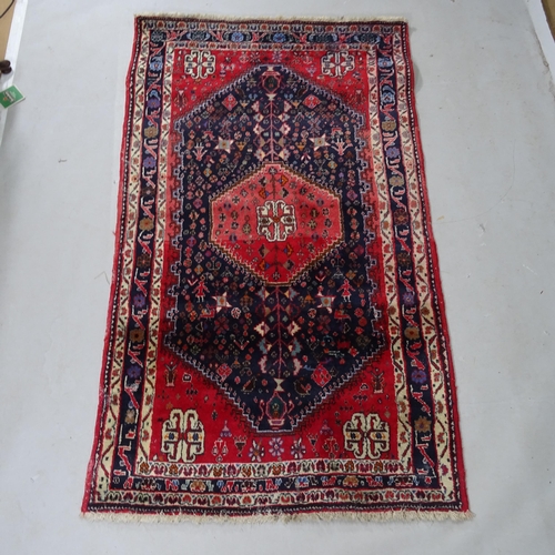 2419 - A red ground Afghan rug, 185cm x 105cm