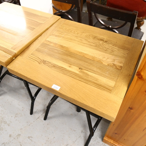 2723 - A pair of modern rise and fall pub tables with metal base, top dimensions 61cm x 56cm