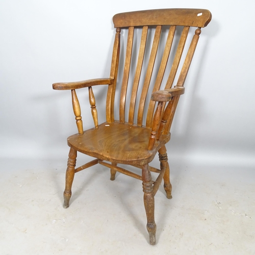 2657 - An elm-seated Windsor kitchen arm chair