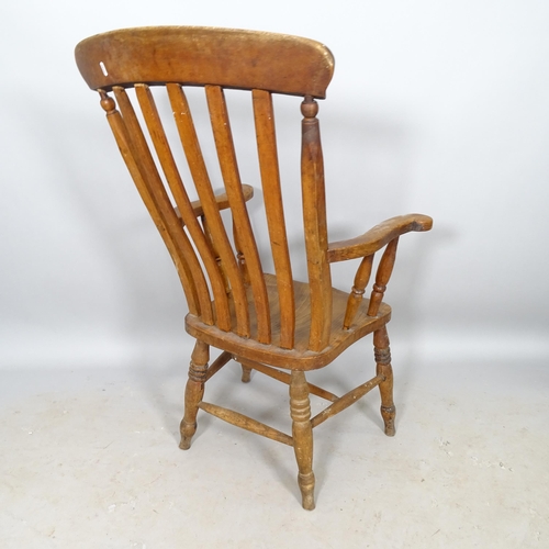 2657 - An elm-seated Windsor kitchen arm chair