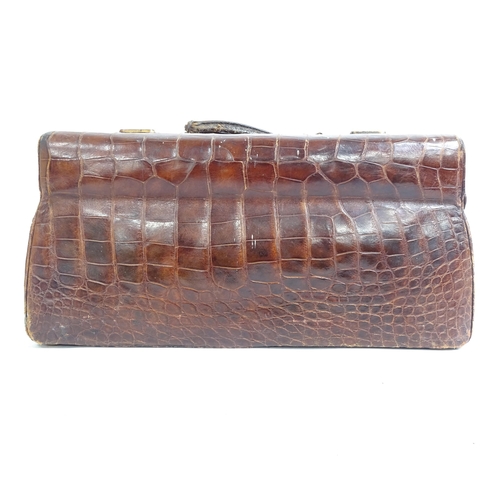 64 - HARRODS - an Antique crocodile skin Gladstone bag, W40cm, H20cm, D26cm