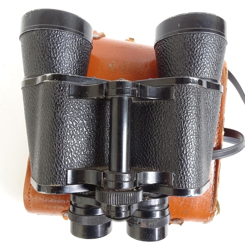 214 - A pair of Tecnar by Swift 8x30 binoculars, serial no. 15445, cased, and a pair of Zenith 10x50 binoc... 