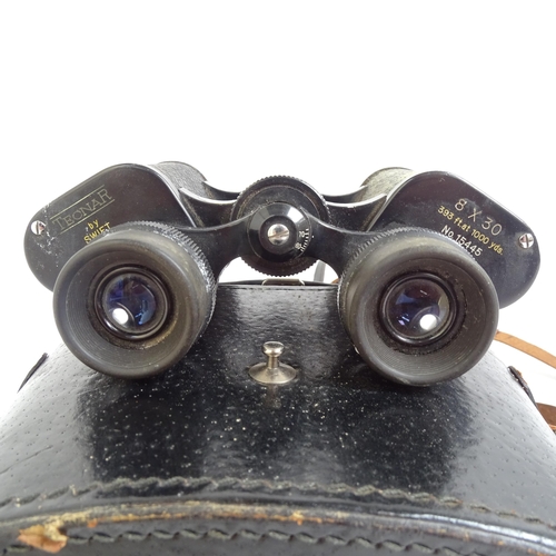 214 - A pair of Tecnar by Swift 8x30 binoculars, serial no. 15445, cased, and a pair of Zenith 10x50 binoc... 