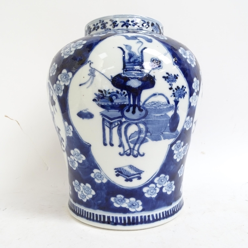 216 - A large Chinese blue and white ginger jar and cover, with genre panels on prunus decorated ground, h... 