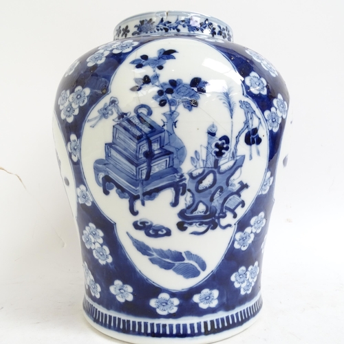 216 - A large Chinese blue and white ginger jar and cover, with genre panels on prunus decorated ground, h... 