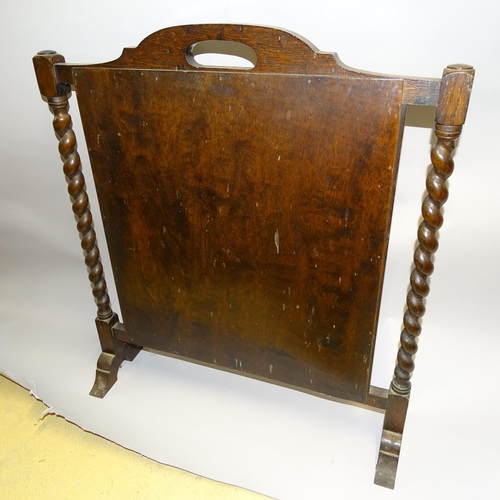 2726 - A 1920s oak barley twist fire screen with tapestry panel. H - 72cm.