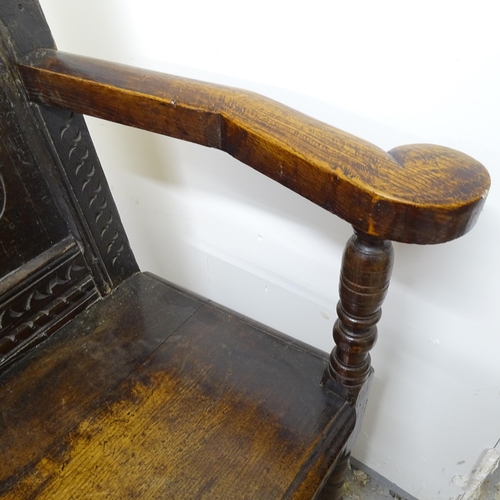 2599 - A 18/19th Century carved and panelled oak Wainscott Hall chair