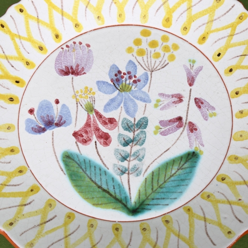 1520 - A Gustavsberg faience hand painted plate, makers mark to base, diameter 17.5cm