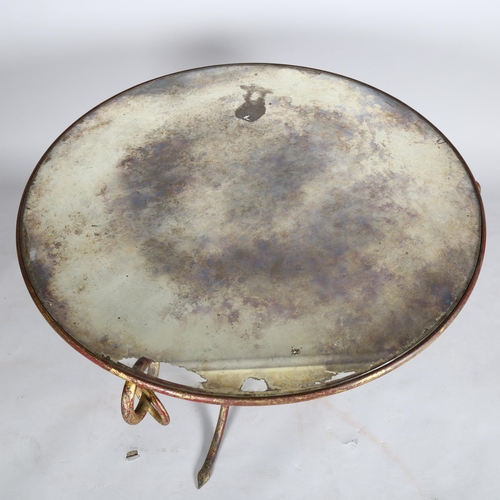 1566 - RENE DROUET, a French wrought iron coffee table, with distressed mirror top, height 52cm, diameter 8... 