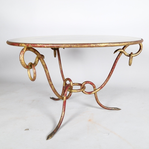 1566 - RENE DROUET, a French wrought iron coffee table, with distressed mirror top, height 52cm, diameter 8... 