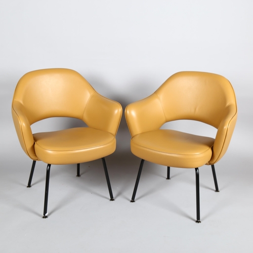 1600 - EERO SAARINEN, a pair of Knoll Executive armchairs in tan leather with impressed Knoll Studio to leg... 