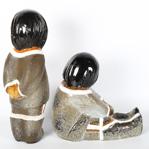 1630 - VICKE LINDSTRAND for Uppsala Ekeby, Sweden, a pair of ceramic Innuit figure designed 1947, pattern n... 