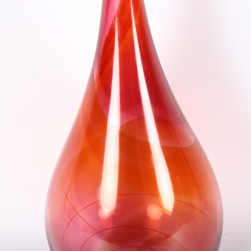 1643 - PHIL ATRILL studio glass, a ruby and amber bottle, signed to base, height 33cm