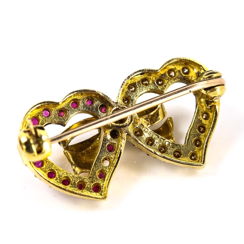 192 - A late 20th century 18ct gold ruby and diamond double-heart brooch, set with round-cut rubies and mo... 