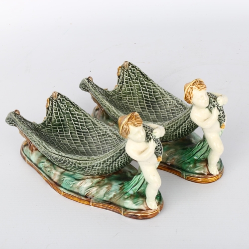 1010 - Pair of Wedgwood Majolica bowls in the form of Classical boys pulling fishing nets, impressed marks ... 