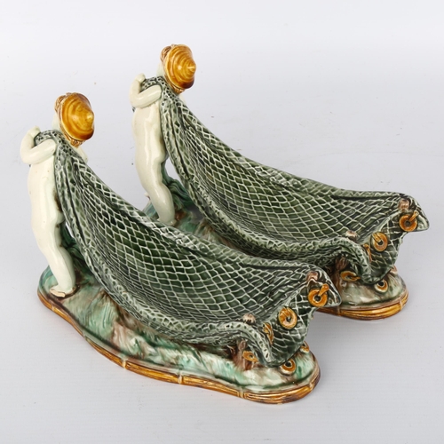 1010 - Pair of Wedgwood Majolica bowls in the form of Classical boys pulling fishing nets, impressed marks ... 