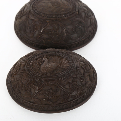 1014 - A pair of 19th century fine relief carved half coconut shells, length 8cm