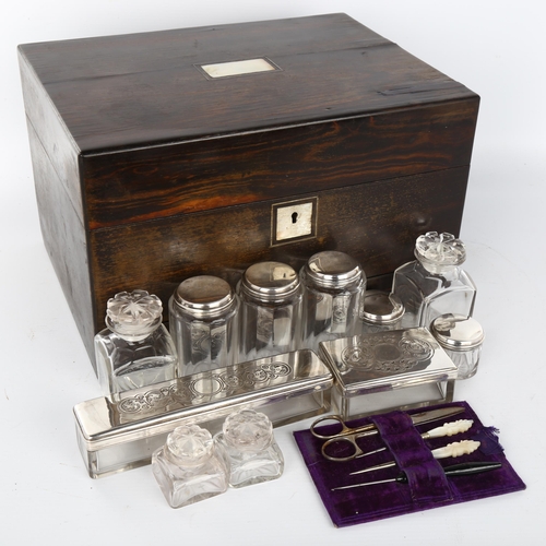 1018 - A 19th century coromandel travelling box, the interior fitted with cut-glass and electroplate boxes,... 