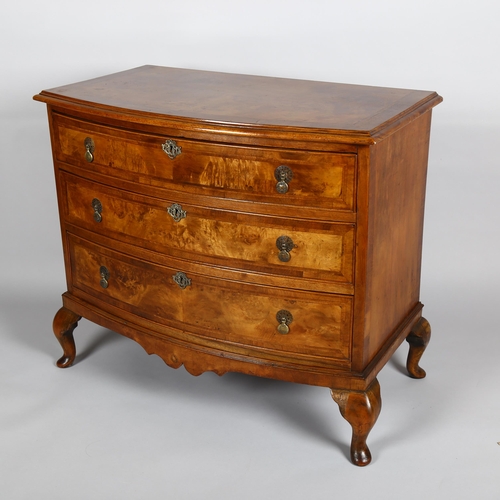 1024 - A burr-walnut bow-front chest of 3 long drawers, early 20th century on cabriole legs, width 90cm, de... 