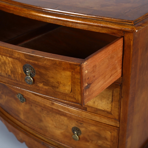 1024 - A burr-walnut bow-front chest of 3 long drawers, early 20th century on cabriole legs, width 90cm, de... 