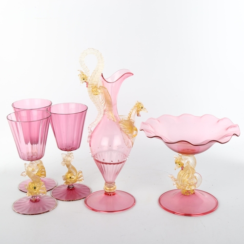 1031 - A group of Venetian pink and gold glass, including a ewer with dragon mounts, height 29cm, matching ... 