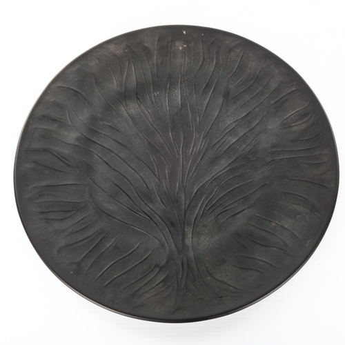 1045 - RENE LALIQUE - a black frosted glass plate with relief moulded tree design, engraved signature, diam... 