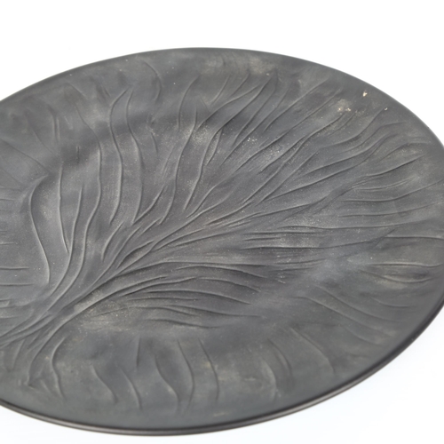 1045 - RENE LALIQUE - a black frosted glass plate with relief moulded tree design, engraved signature, diam... 