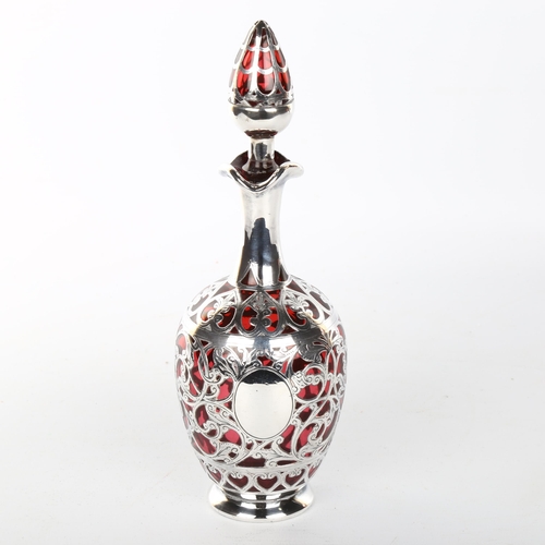 1048 - A 19th century cranberry glass and silver overlay decanter and stopper, height 22cm