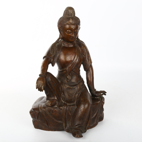 1066 - A Chinese patinated bronze seated Buddha, with inlaid wirework clothing, height 30cm