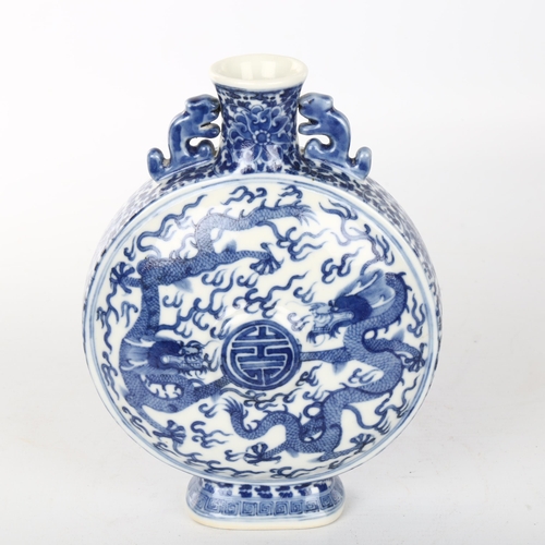 1073 - A Chinese blue and white porcelain moon flask, hand painted dragon decoration, 4 character mark, hei... 