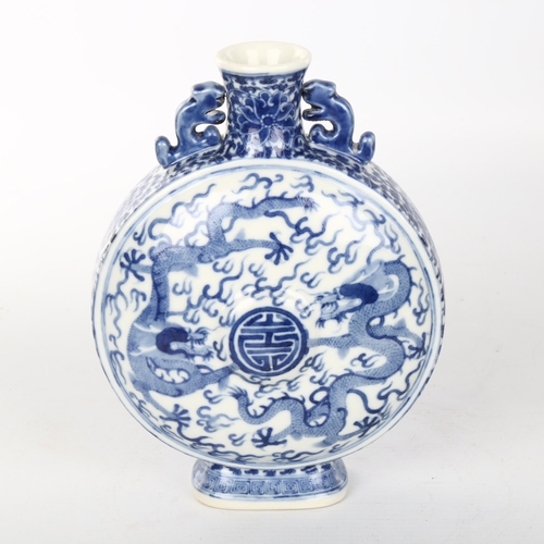 1073 - A Chinese blue and white porcelain moon flask, hand painted dragon decoration, 4 character mark, hei... 