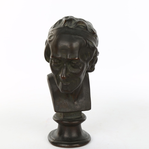 1084 - A 19th century patinated bronze head and shoulders bust of Voltaire, unsigned, height 22cm