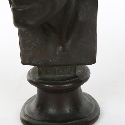 1084 - A 19th century patinated bronze head and shoulders bust of Voltaire, unsigned, height 22cm