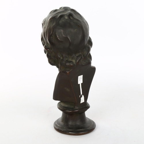 1084 - A 19th century patinated bronze head and shoulders bust of Voltaire, unsigned, height 22cm