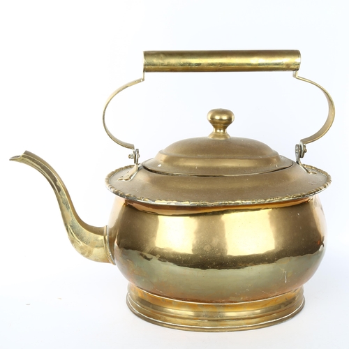 1101 - A very large brass kettle, probably early 20th century, overall length 50cm