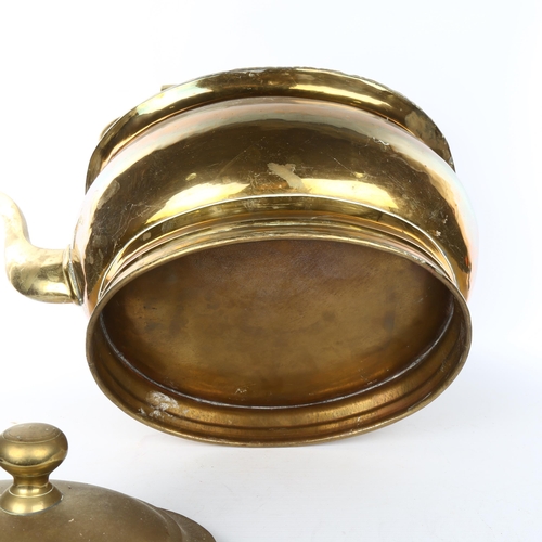 1101 - A very large brass kettle, probably early 20th century, overall length 50cm