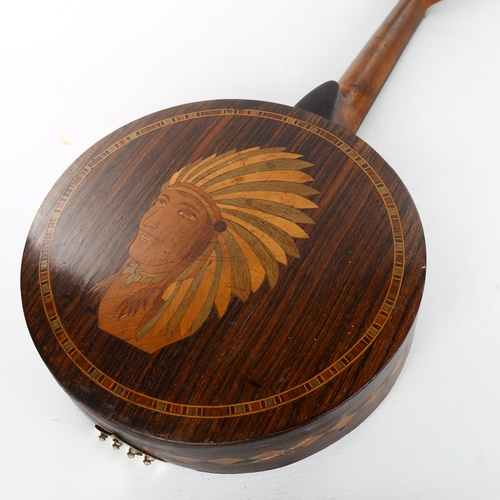 1102 - An American rosewood banjolene with marquetry inlaid Native American design, late 19th or early 20th... 