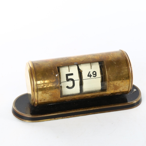 1104 - An Art Deco brass drum-cased split flap desk timepiece, by Endura Time Corp West Germany, on black e... 