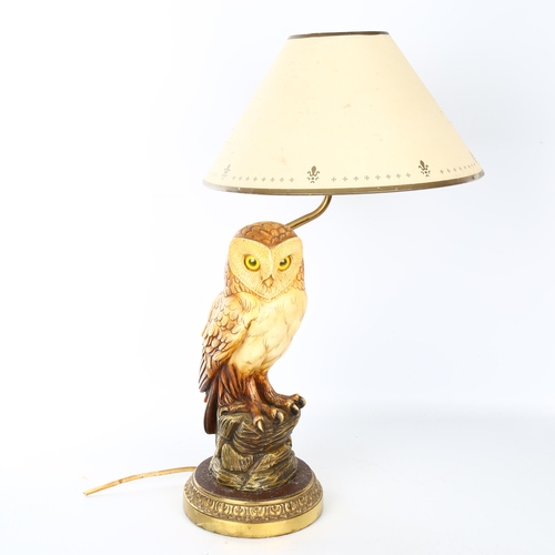 1110 - A composition and brass owl design table lamp and shade, overall height 50cm