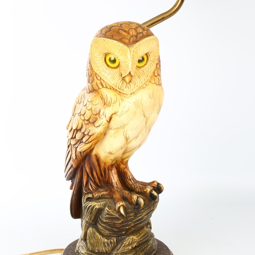 1110 - A composition and brass owl design table lamp and shade, overall height 50cm