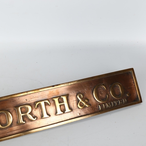 1112 - F. W. Woolworth & Co. Limited relief cast-bronze name plaque on bronze brackets, 63.5cm x 7.5cm