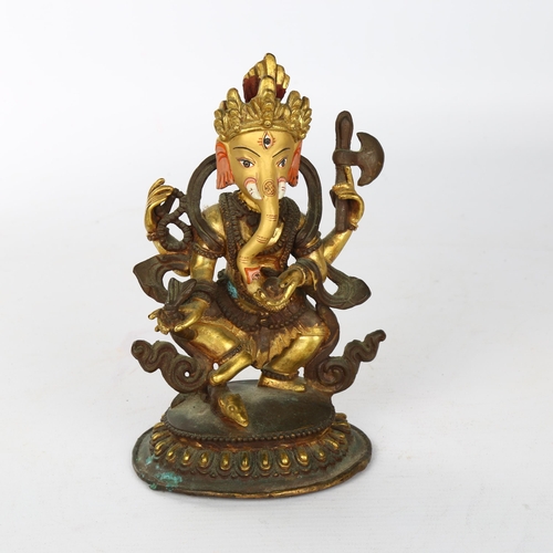 1113 - An Indian bronze figure of Ganesh, parcel gilt and painted decoration, height 16cm