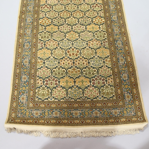 1129 - A Turkish handmade silk rug, 173cm x 108cm