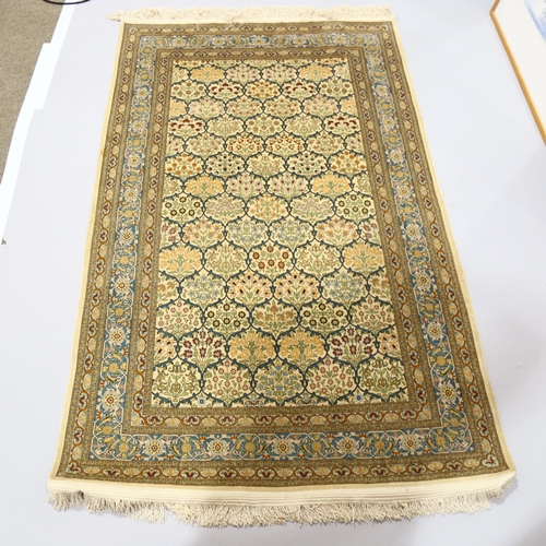 1129 - A Turkish handmade silk rug, 173cm x 108cm