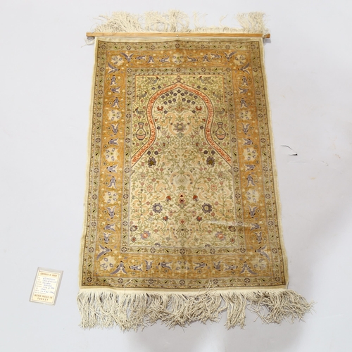 1131 - A Turkish handmade silk rug, 88cm x 60cm