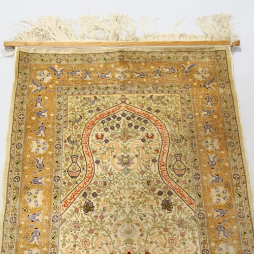 1131 - A Turkish handmade silk rug, 88cm x 60cm