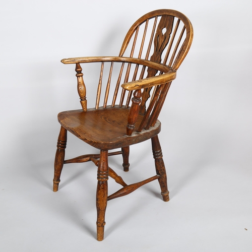 1133 - A late 19th century elm-seated bow-arm Windsor chair