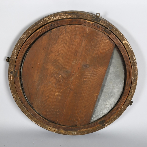 1136 - An early 19th century gilt-framed convex wall mirror, diameter 56cm