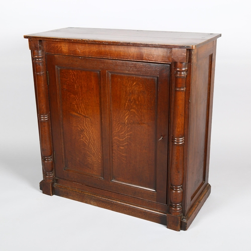 1137 - A Georgian oak side cupboard, with panelled door and split turned column, width 85cm, depth 38cm, he... 