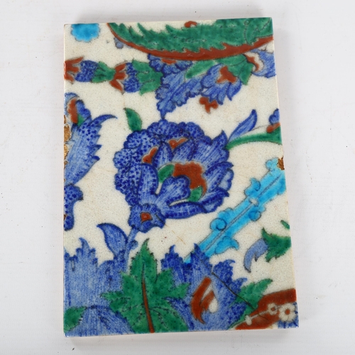 1141 - A Middle Eastern Iznik pottery tile, 24cm x 16cm